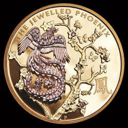 The Jewelled Phoenix Gold Coin. Features diamonds that form a rose gold Chinese Phoenix landing on a Paulownia tree.