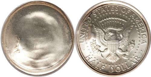 Kennedy Half Dollar Error Coin. The obverse features a blank coin with no design. The reverse features a typical Kennedy half dollar with an eagle holding arrows and an olive branch. The reverse reads: United States of America, Half Dollar